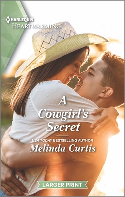Image for A Cowgirl's Secret: A Clean Romance (The Mountain Monroes, 9)